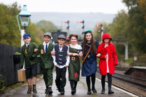 Children from a primary school in Sunderland dress as evacuees at Grosmont Station, North Yorkshire. October 16 2015. Re-enactors from around Britain are making their way to North Yorkshire for the annual Wartime Weekend held by the North Yorkshire Moors Railway. The events is one of the most popular in the country due to its location at rural stations in the North Yorkshire Moors, attendants can ride the traditional steam trains between the stations enjoying stalls and re-enactments at each stop. The event lasts three days, with Saturday being the most popular. Tea dances are held on an evening for those wanting a jive.
